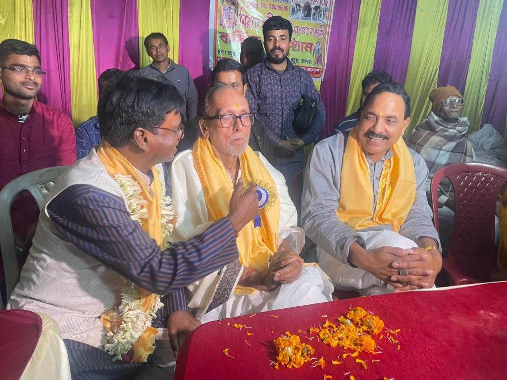 BJP candidate Khagen Murmu took blessings from senior TMC leader Samar Mukherjee.